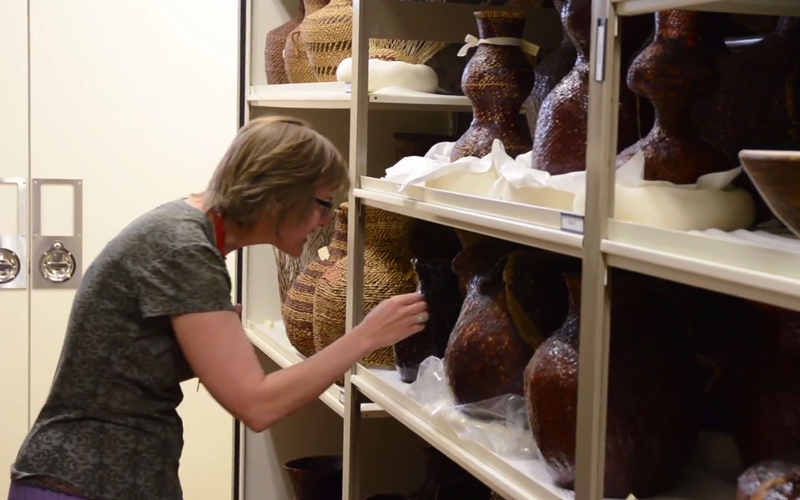 Female looking at artifacts at ASU Museum