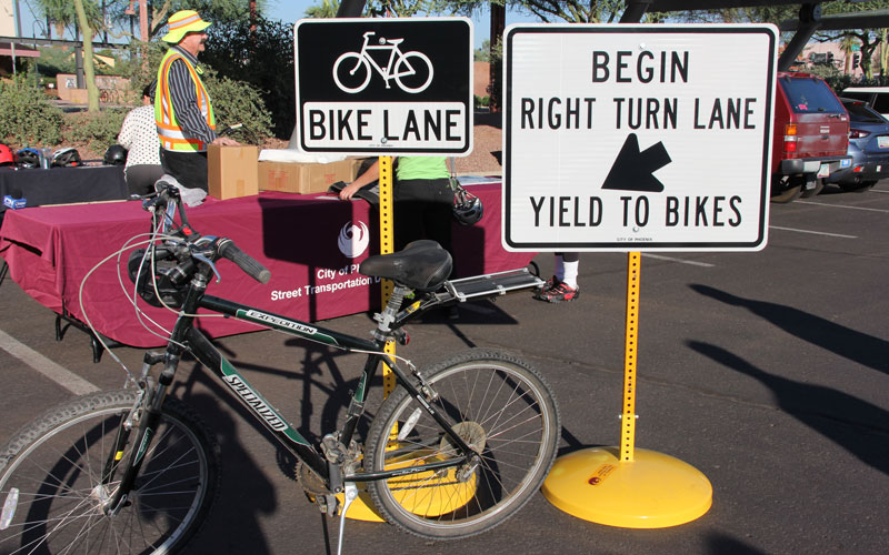 These signs and many others have been placed throughout Phoenix — and will continue to be placed — to help guide bicyclists and motorists in Phoenix. (Photo by Claire Cleveland/ Cronkite News)