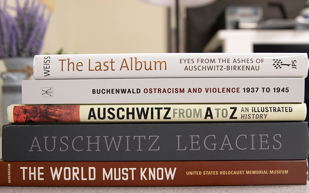 When Amanda Johnson was visiting the Auschwitz-Birkenau concentration camp in Poland, she didn’t take photos of the heart-wrenching scenes at the memorial. Instead, she bought books to share with her students and help them learn about the millions of Jewish people who were killed during the Holocaust. Photo taken on Sept. 6, 2022, at Corona del Sol High School in Tempe. (Photo by Sophie Oppfelt/Cronkite News)