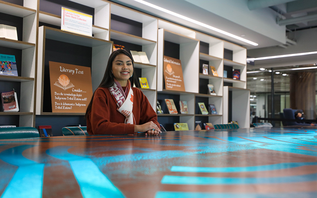 Lourdes “Lulu” Pereira is a student worker at the Labriola Center and the official archivist for the Hia-Ced Hemajkam LLC, which was established in 2015 to work toward federal recognition and reclamation of ancestral lands. Photo taken Dec. 1, 2022, at Hayden Library in Tempe. (Photo by Campbell Wilmot/Cronkite News)