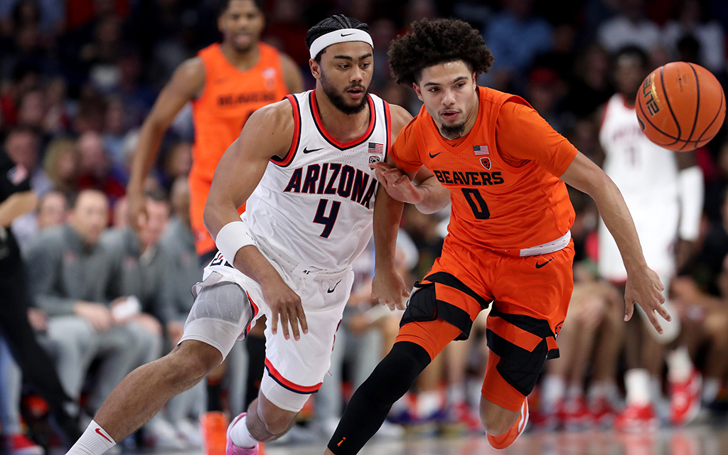 University of Arizona men's basketball player Kylan Boswell and Oregon State men's basketball player Jordan Pope during a game.