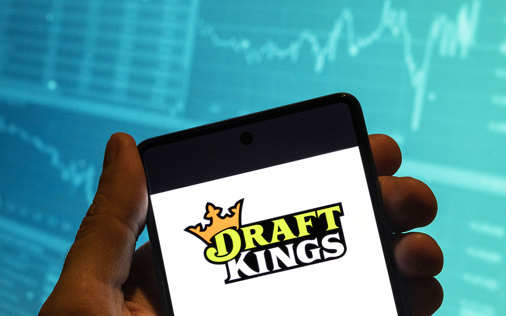 The legalization of sports betting in Arizona has generated billions in revenue, thanks in part to mobile apps like DraftKings that allow gamblers easy access. (Photo Illustration by Budrul Chukrut/SOPA Images/LightRocket via Getty Images)