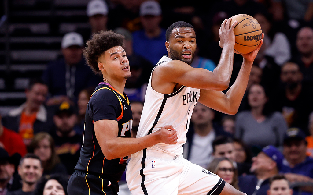 Less than a month ago, T.J. Warren, right, and Cameron Johnson wore different jerseys. A trade means Warren is back in a Suns uniform and Johnson is sporting one from the Brooklyn Nets. (Photo by Chris Coduto/Getty Images)