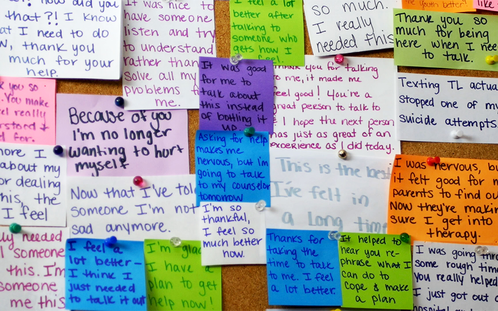 Counselors receive messages from teenagers who have called in to express their gratitude. Teen Lifeline keeps the messages and hangs them in their hotline room. (Photo courtesy of Teen Lifeline)