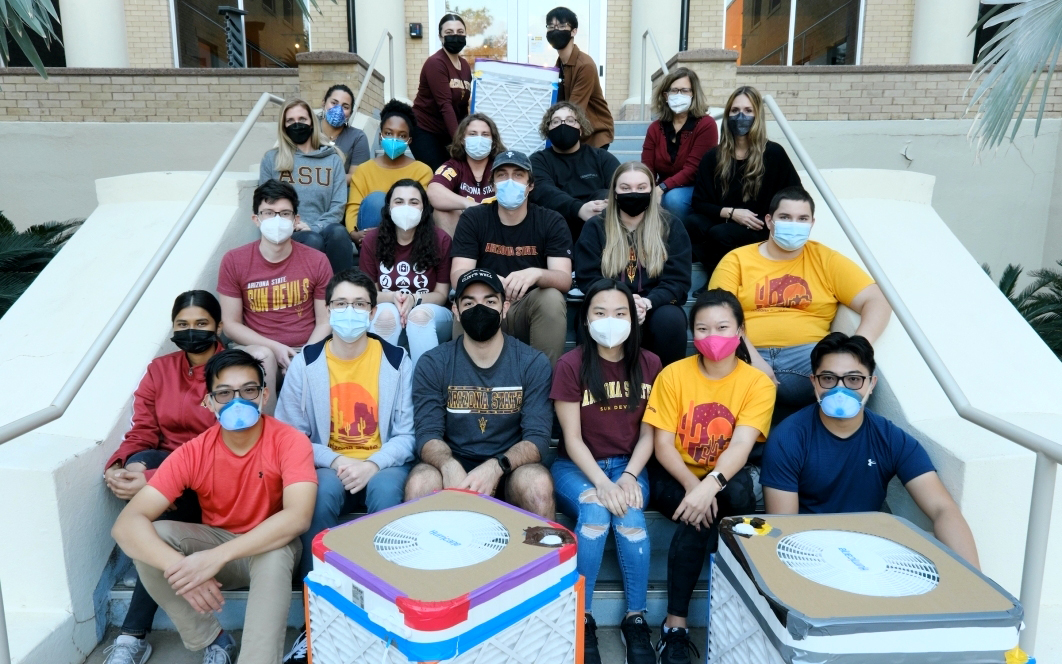 Student volunteers at the end of a "box-a-thon" build day in 2022 outside ASU’s School of Human Evolution and Social Change on the Tempe campus. (Photo by Steve Filmer/ASU News)