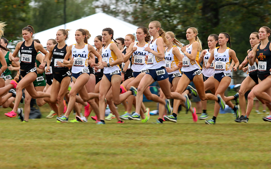 NAU women's cross-country runners running.
