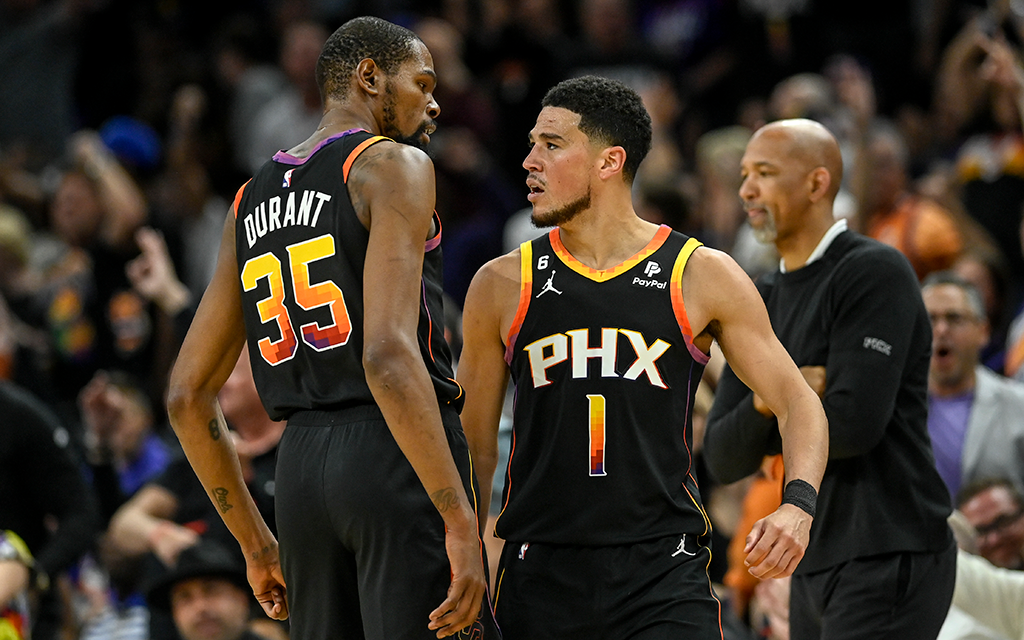 Suns players Devin Booker and Kevin Durant standing next to each other.