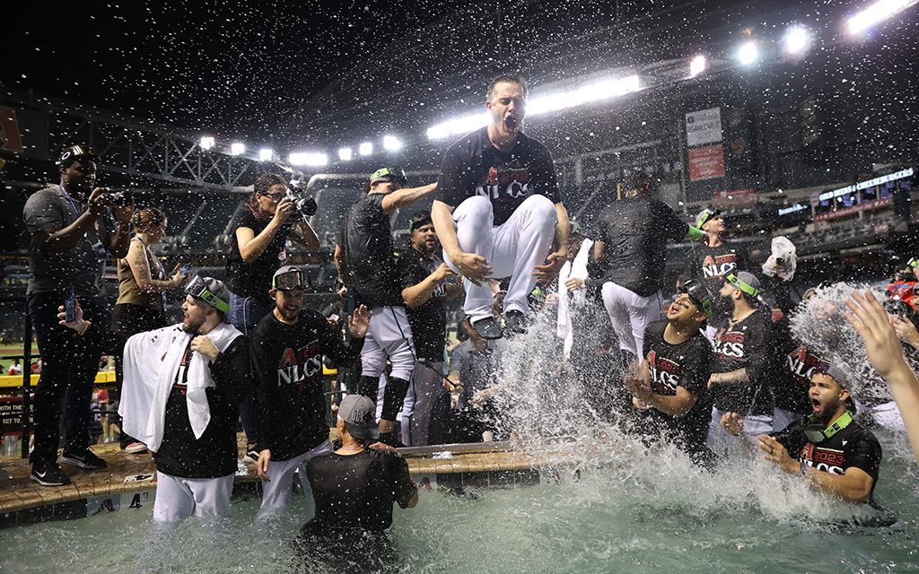 Diamondbacks' players jumping in pool.