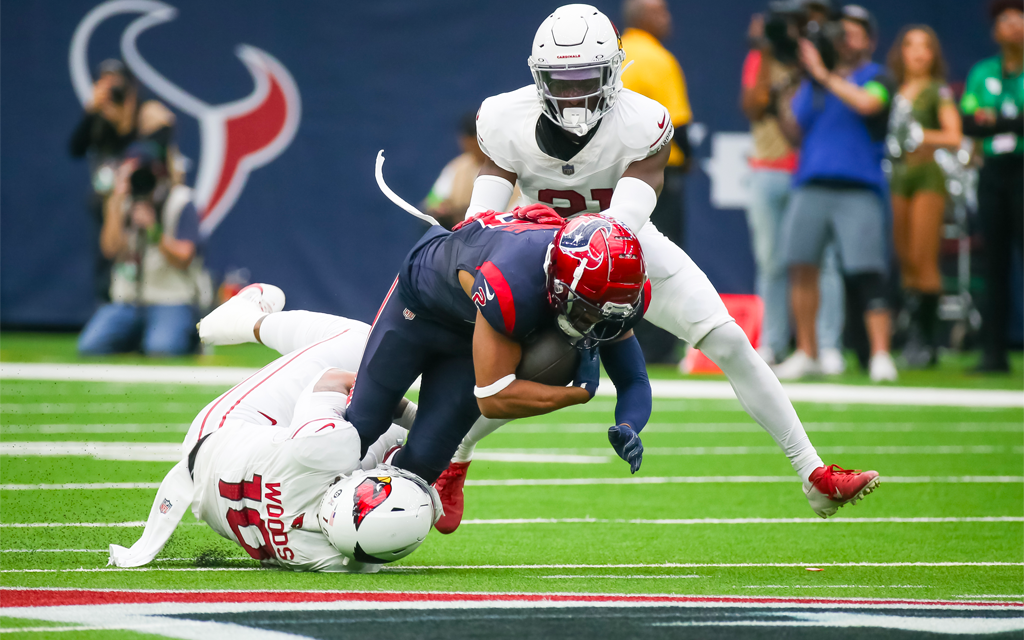 Cardinals player make tackles
