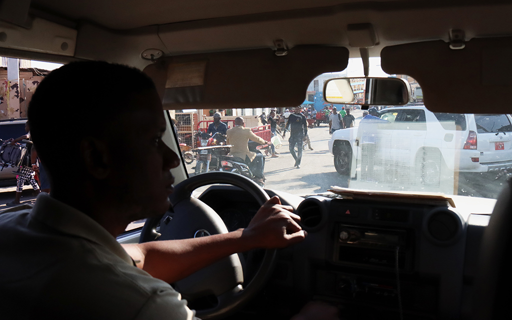 Stanley Payoute, a doctor with AIDS Healthcare Foundation Haiti, drives across the Haitian border into the Dominican Republic to meet with Cronkite News reporters on March 5, 2023, in Dajabon, Dominican Republic. Payoute drove with two patients and a nurse from his clinic in Cap-Haitien, Haiti. (Photo by Albert Serna Jr./Cronkite Borderlands Project)