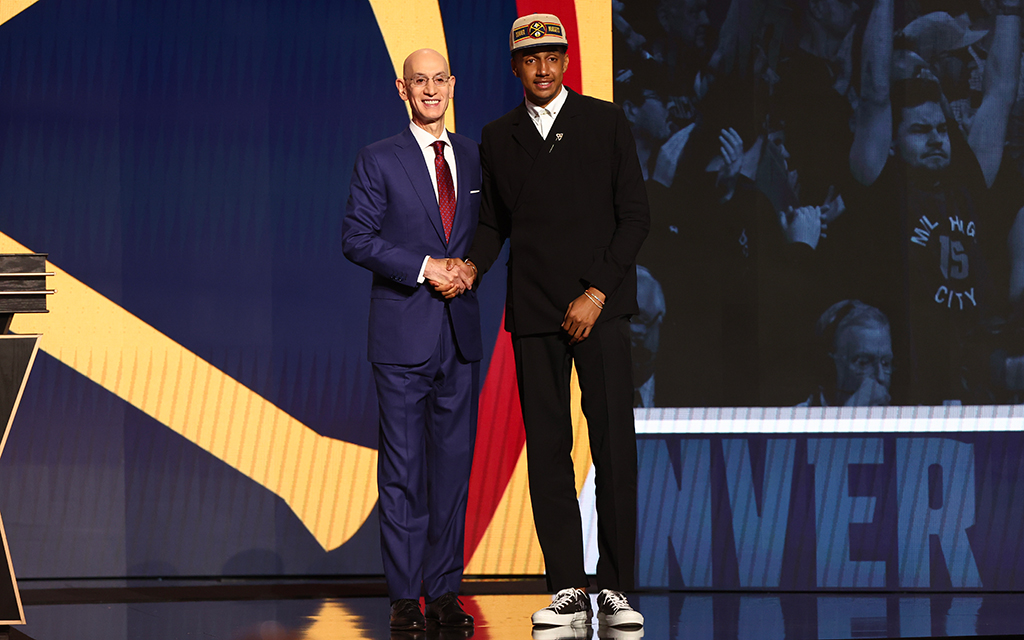 Ryan Dunn, former Virginia forward, shakes hands with NBA commissioner Adam Silver after being selected in the first round of the NBA Draft. (Photo by Sarah Stier/Getty Images)