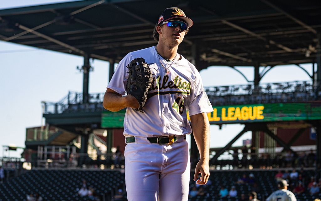 Nick Kurtz standing at the end of an inning during a baseball game.